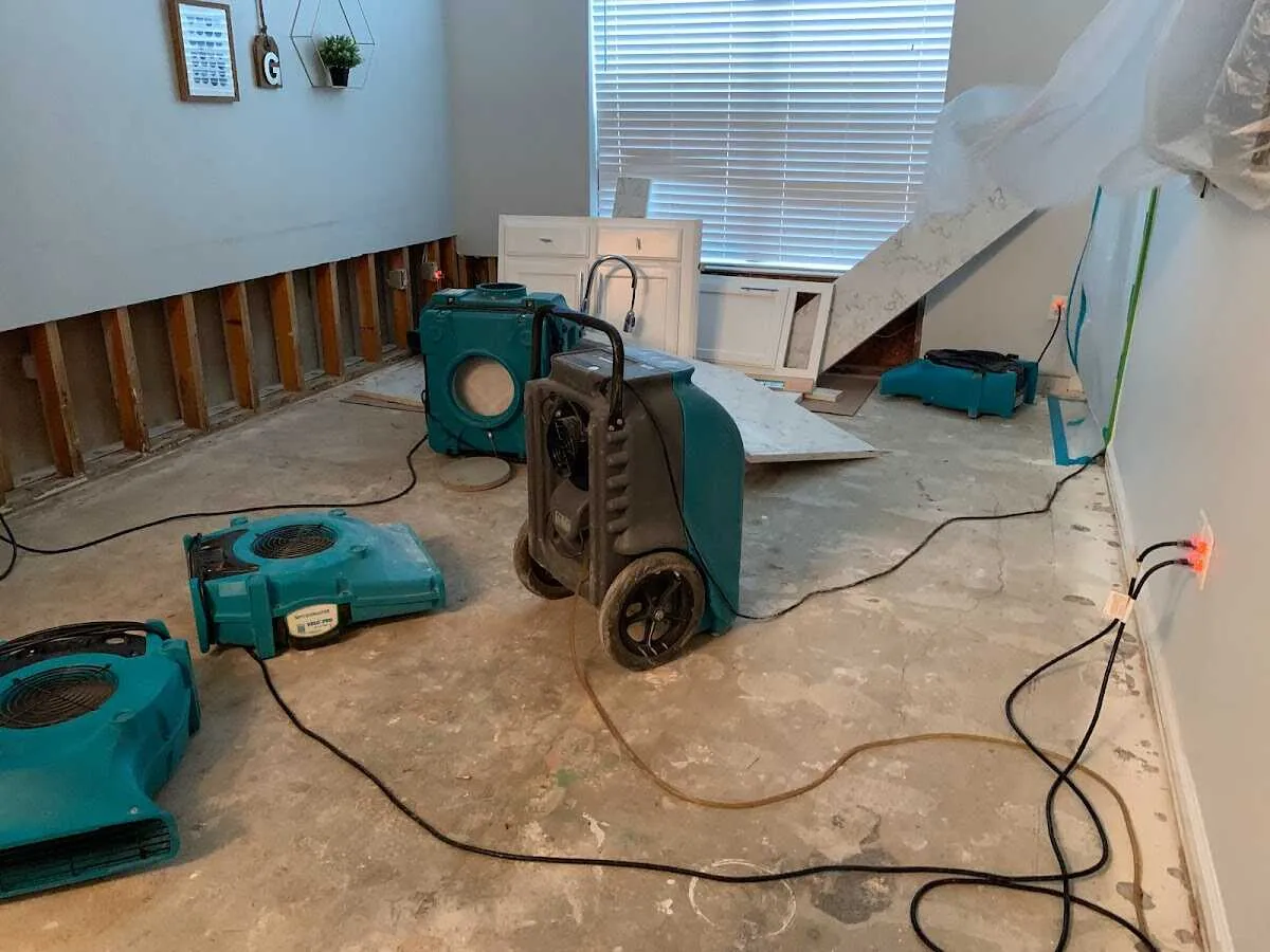 Dehumidifier in flood-cut room for Water Damage Restoration in Burnet